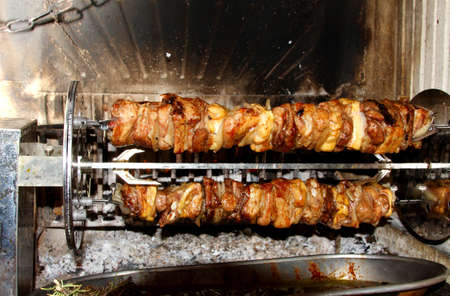 spit roast with tasty meat cooked in the fireplace 3の写真素材