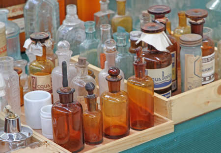 very old bottle of glass with medicine for sale in a european flea marketの写真素材