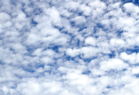 many white clouds and a perfect blue sky