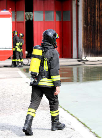 brave firefighter with oxygen tank in action のeditorial素材