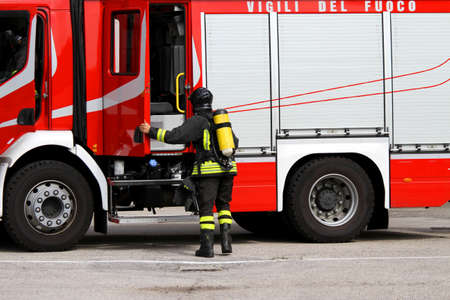 brave firefighter with oxygen tank in action のeditorial素材