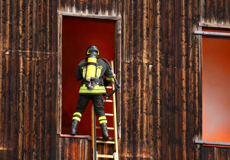 brave firefighter with oxygen cylinder during a fire drill at Firehouse のeditorial素材