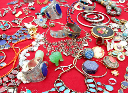 jewelry and antique trinkets back in flea marketの写真素材
