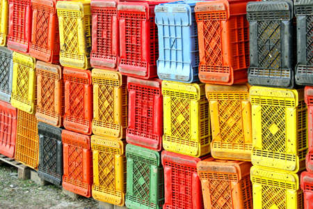 many  plastic box for collecting fruits and grapes on the farmの写真素材