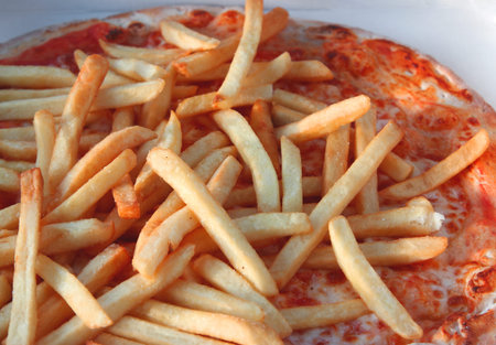 Tasty pizza with mozzarella tomato and French fries
