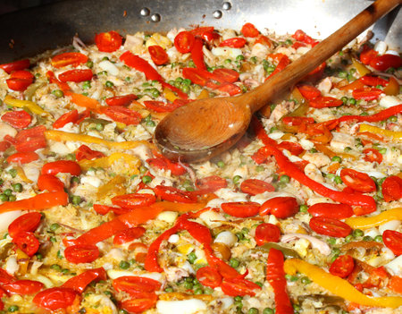 wooden spoon on Valencian paella at the spanish restaurantの写真素材