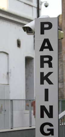 written PARKING a car park monitored by CCTV camerasの写真素材