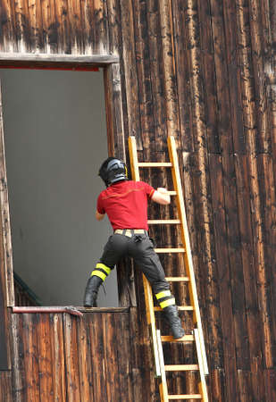 firefighters entered the window of a houseの写真素材