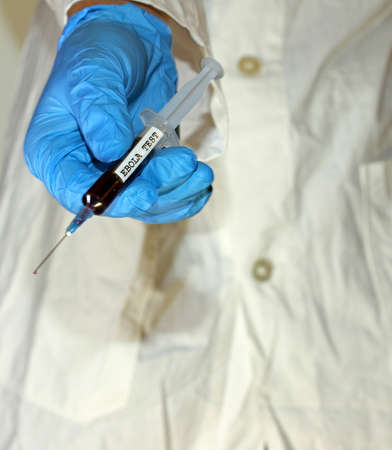 doctor with syringe to test ebola virusの写真素材