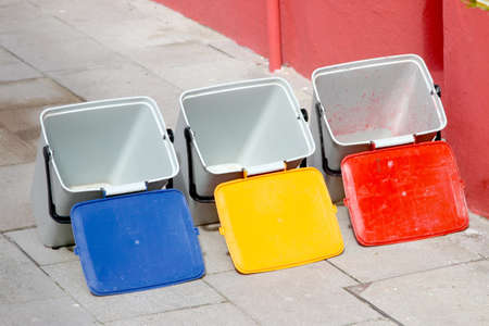 three buckets for recycling of municipal wasteの写真素材