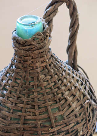 bottle antique Wicker-clad to hold wine and oilの写真素材