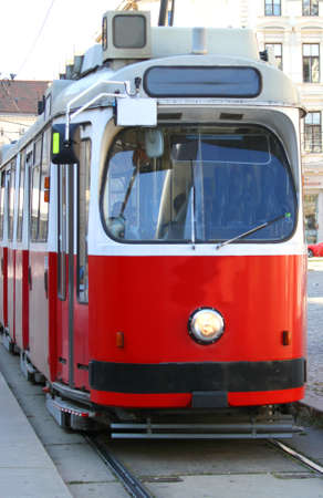 ecological red tram carries passengers for European citiesのeditorial素材