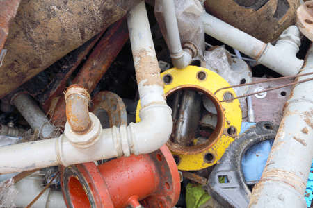 rusted iron pipes of a landfill of ferrous materialの写真素材