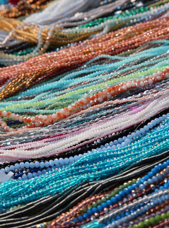 many necklaces and bracelets for sale at flea market