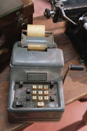 ancient mechanical calculator manual with white keysの写真素材