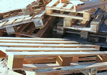 pile of wooden pallets piled in a landfill