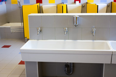 small bathrooms of a school for children with low ceramic sinks