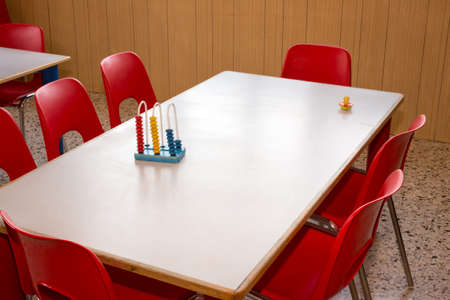 nursery with red chairs and small desksの写真素材