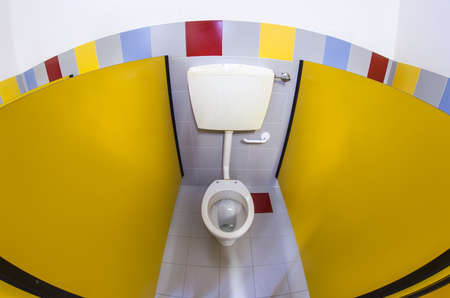 small bathroom of a school for children with white water closetの写真素材