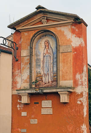 ancient votive capitals with the image of the madonna in Italyの写真素材