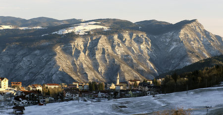 winter landscape with mountains and the small village of TONEZZA del Cimone, Italy