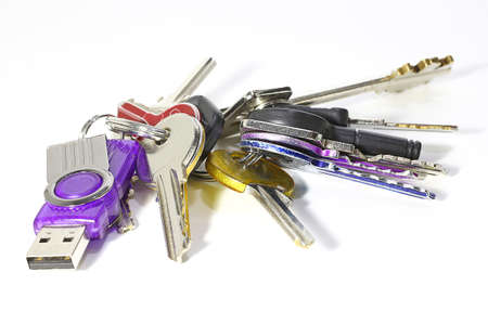 bunch of keys of many sizes and a usb memoryの写真素材