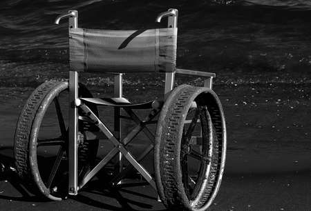 ingenious wheelchair with stainless steel wheelsの写真素材