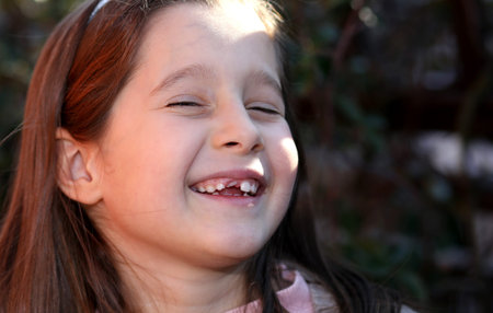 portrait of pretty girl with brown hair and happy expression