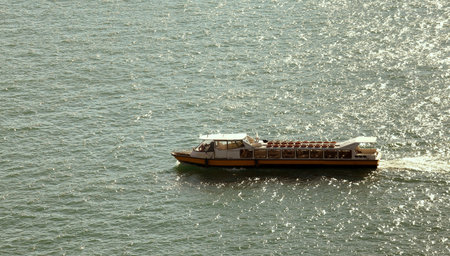 sailing boat in the lagoon of Venice in backlightの写真素材