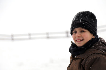 Portrait of young boy in winterの写真素材