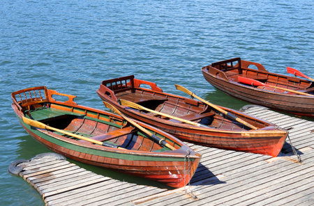 three rowboats moored on the shore of little Lake