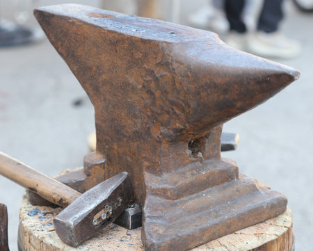 heavy ANVIL and sturdy HAMMER in the blacksmith's shop