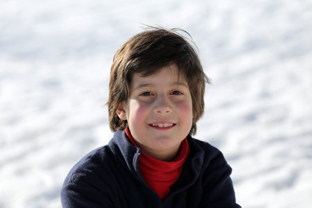 Portrait of a cute little boy t in the mountainsの写真素材