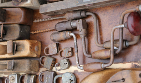 hand drill old rusty padlocks and planers in the workshop of flea market