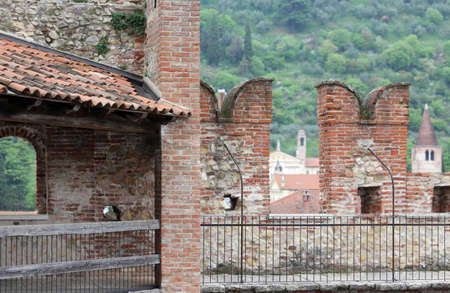 ancient castle walls with big battlements for defense of the medieval Manorのeditorial素材