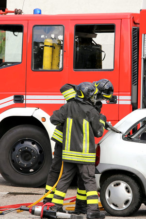 brave firefighters relieve an injured after an accident during a practice session in the fire...