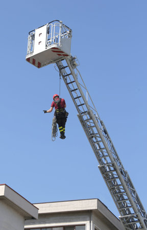 firefighters hung the rope climbing during the practical exercise in firehouse