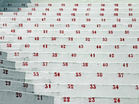 red numbers in the stands of the stadium of soccerの写真素材