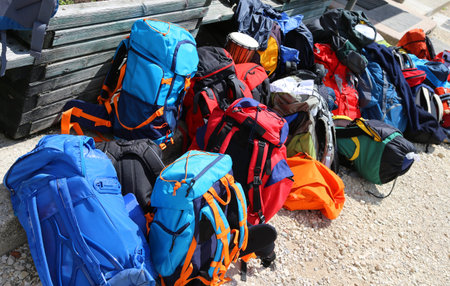 many backpacks of hikers before departure in the high mountains