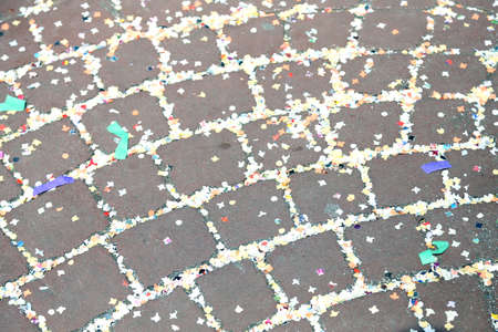 colorful confetti to the street of Venice after the Carnival paradeの写真素材