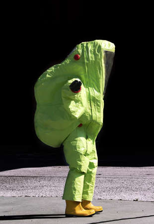 person with yellow protective suit, anti-glare to avoid counting by bacteria and virusesの写真素材