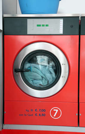 large industrial washing machine launderette with coin operationの写真素材
