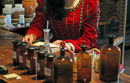 ancient apothecary recipes in the book studies with cans with herbs in pharmacy