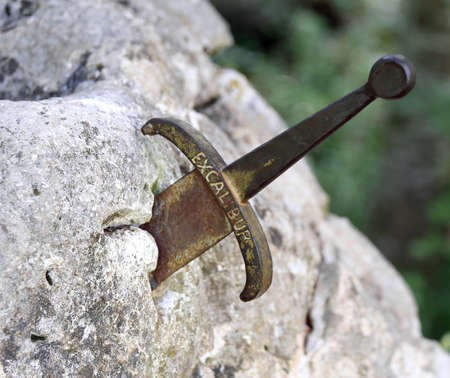 excalibur the famous sword in the stone of king Arthur in the forestの写真素材
