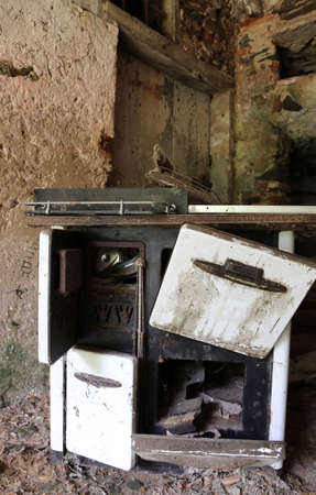 ancient wood-burning stove of old kitchen in an old abandoned houseの写真素材