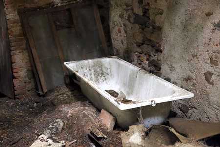 dirty old bathtub in unsafe House destroyed and abandonedの写真素材