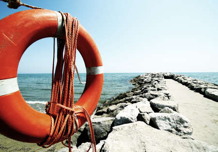 Orange jackets with rope to rescue swimmers in the sea in summerの写真素材
