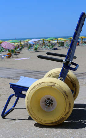 Special wheelchair with large floats wheels to go in the sea in summerの写真素材