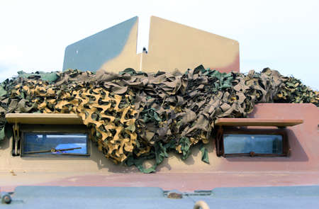 armored military truck with camouflage gear for war missionsの写真素材