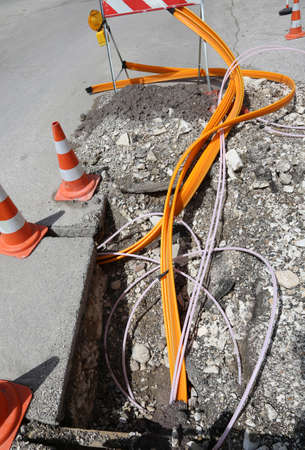 Road construction with pipes for laying optical fiber for high speed internetの写真素材